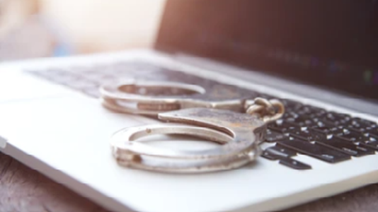 Police Celebrate Arrest of 59 Suspected Scammers
