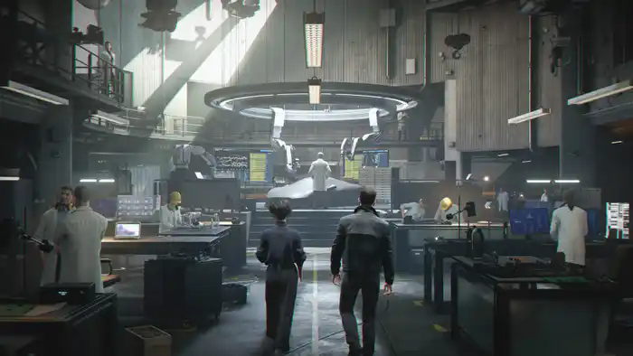 Bond and another agent walk into the technology lab